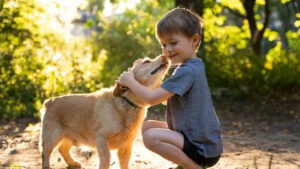 child_plays_with_dog_